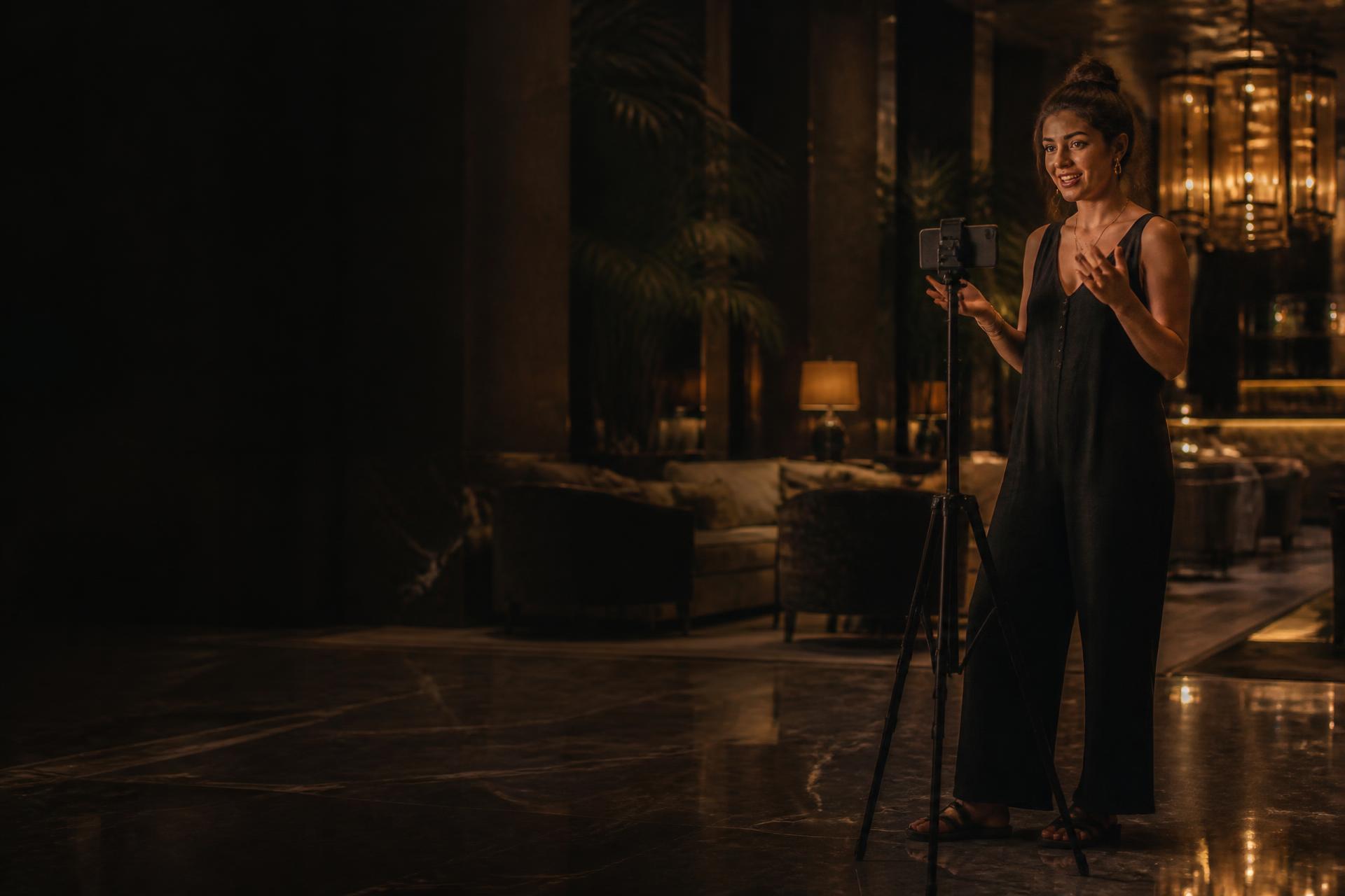 Creator filming branded content in a hotel lobby